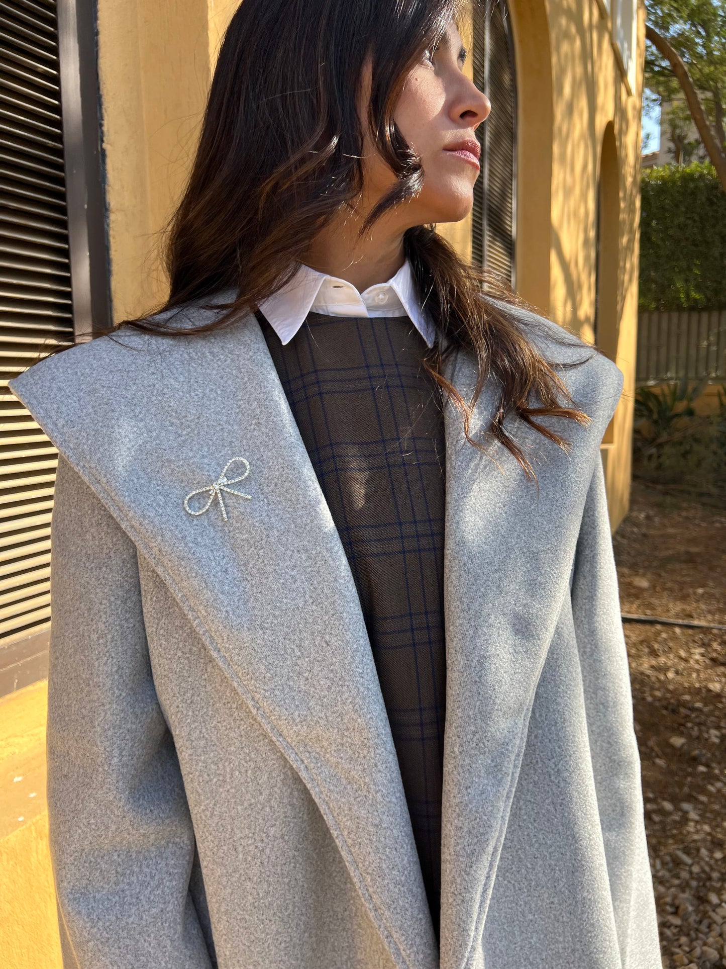 Everyday winter jacket with a ribbon pin